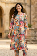 Woman modeling the vibrant Painted Petals 2 piece printed lawn unstitched suit by Dorikhas, featuring a multi-colored watercolor floral print.