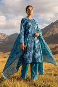 Low-angle view highlighting Oceanic Mirage 3 piece blue printed lawn suit and dupatta by Dorikhas Pakistan.
