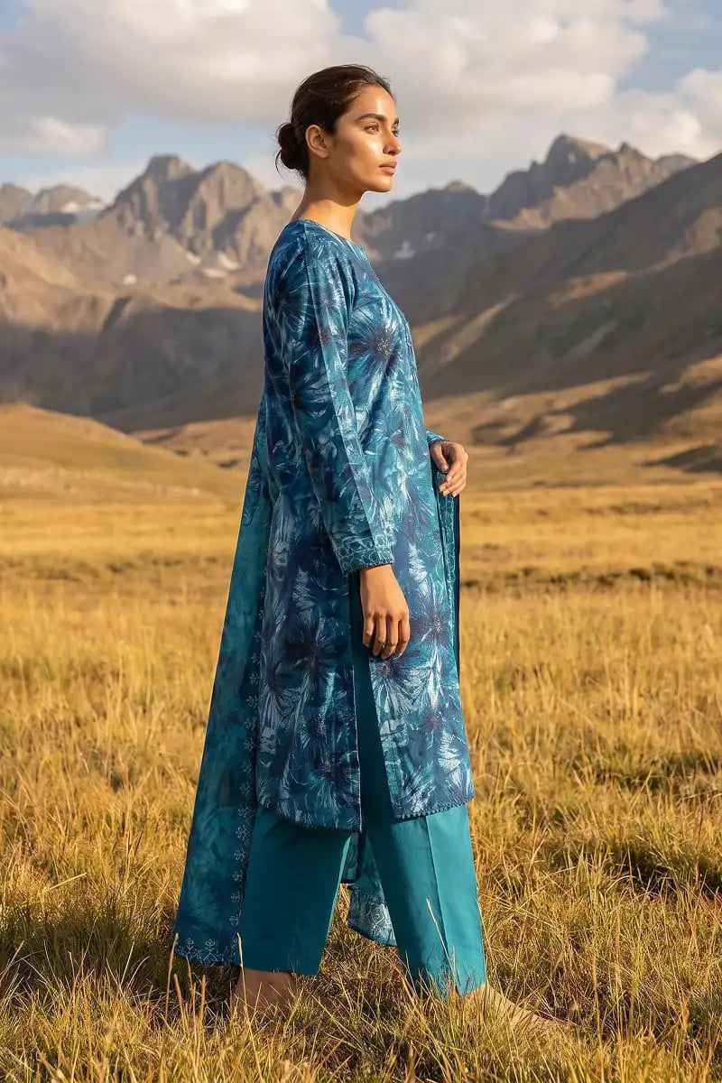 Side view of model presenting Oceanic Mirage 3 piece unstitched printed lawn collection by Dorikhas Pakistan.