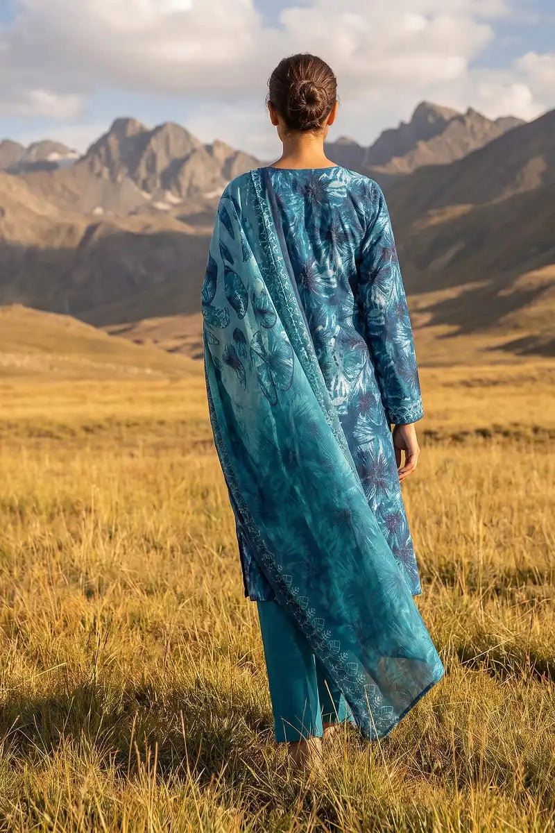Back view of model wearing Oceanic Mirage 3 piece unstitched printed lawn suit with dupatta by Dorikhas Pakistan.